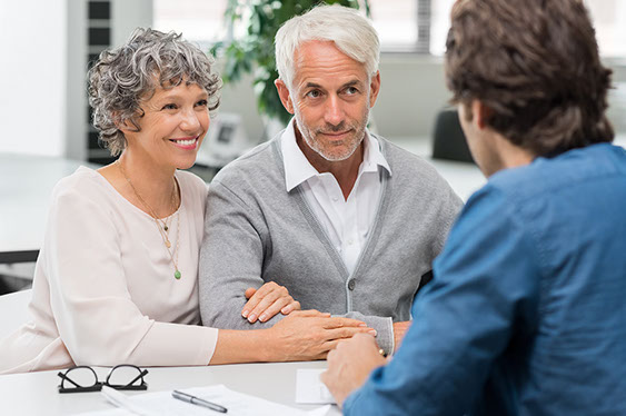 Senior couple meeting real estate agent. Senior couple meeting financial advisor for investment. Happy mature man and woman listening to various investment plans for their retirement.